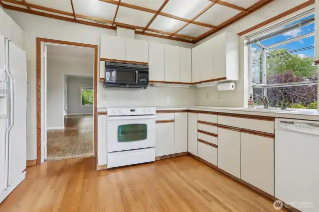Another shot of the kitchen. Newer hardwood flooring.