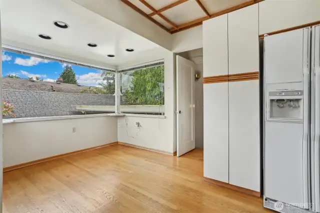 Breakfast nook overlooks patio and back yard.