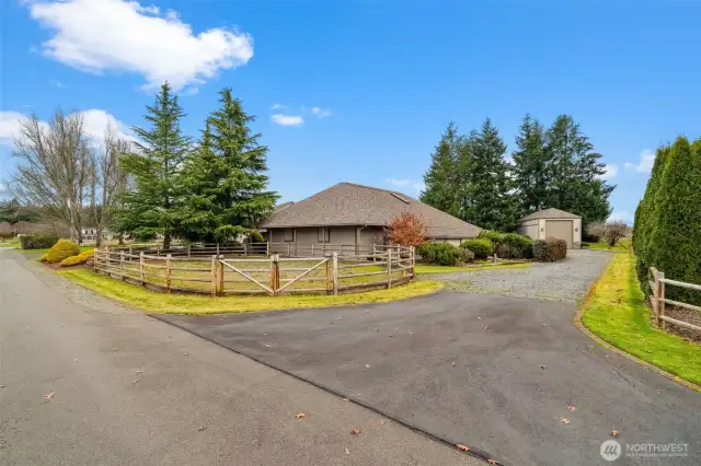 Just past the house you'll find the first outbuilding- a large shop and barn with 4 stalls, and horse paddock.