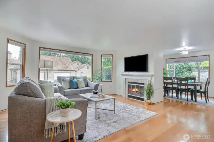 Living/dining areas with hardwood floors, large windows for great natural light. Wood burning fireplae.