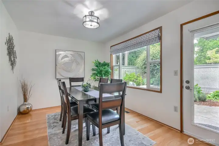 Dining with door to spacious patio and convenient door to your garage.