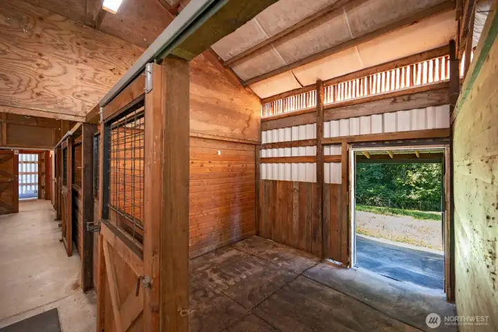 4 horse stalls with interior door and exterior door to fenced pasture