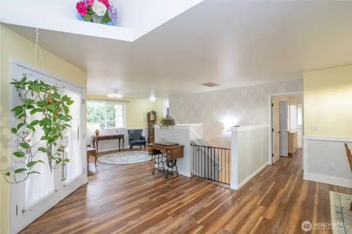Welcoming entry with new LVP flooring throughout the upper-level living areas.