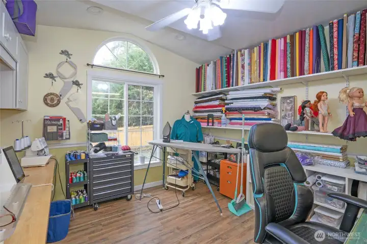 Den/office currently set up as a craft room, offering plenty of workspace.