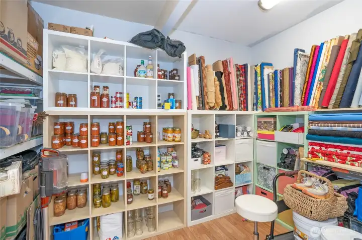 Lower-level finished room with versatile storage options.