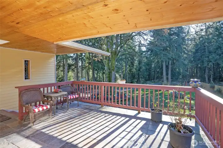 Enjoy the deck off the main entry, overlooking the spacious, manicured front yard.