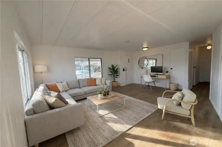 Virtually staged - large open living room.