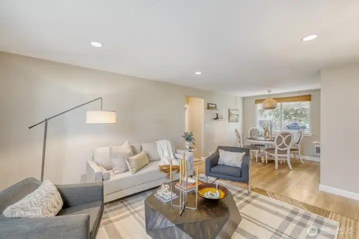 Living room with dining room in background