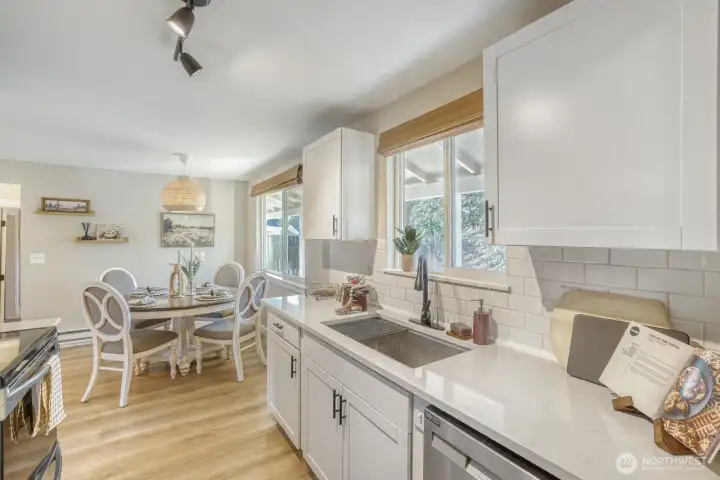 Fully remodeled galley kitchen with dining room