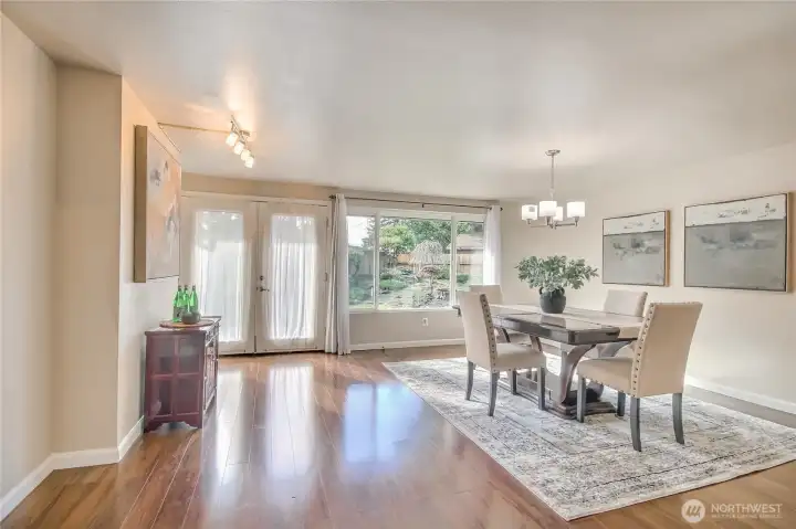 French doors lead to the peaceful backyard