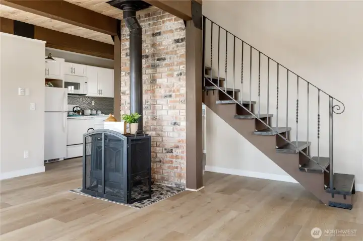 Gas stove heats the entire place but also has electric wall heaters