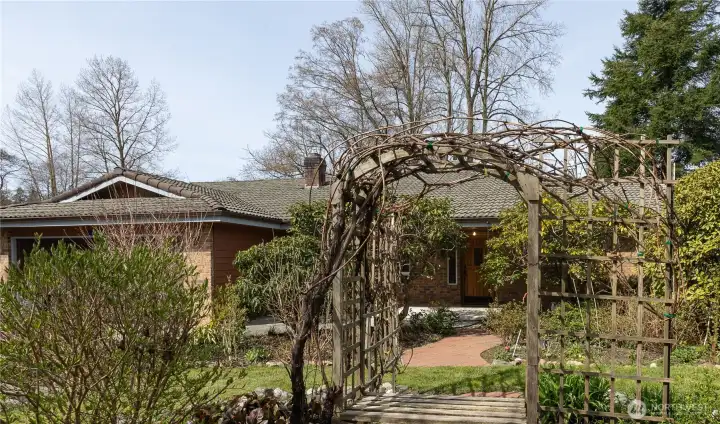 Front door through the beautifully landscaped front garden