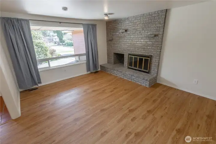 Living room with gorgeous brick fireplace
