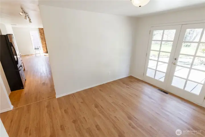 Formal dining room with french doors and view of the backyard and river
