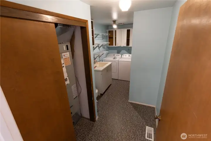 Laundry room, 1/2 bath, furnace, and storage