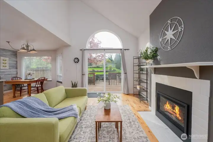Expansive windows invite you into your private backyard.  Patio was structured for a hot tub or possibly just more outdoor living.