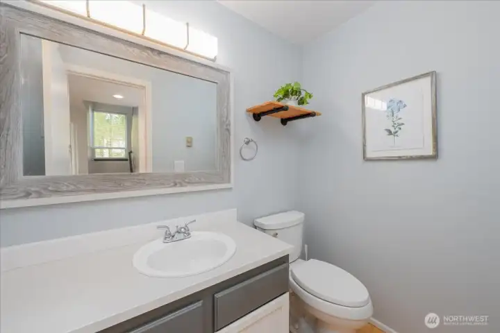 Down stairs 1/2  bathroom is off to the left as you enter the home. New lighting