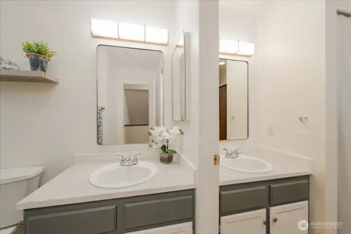 Full bath with a second sink to allow for privacy while bathroom is in use.