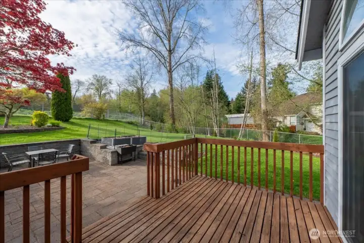 Deck stepping down onto the patio.
