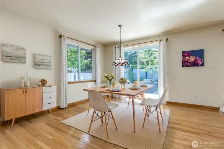 Breakfast nook off the kitchen & family room with slider to back patio. Virtually staged. Breakfast nook off the kitchen & family room with slider to back patio. Virtually staged.