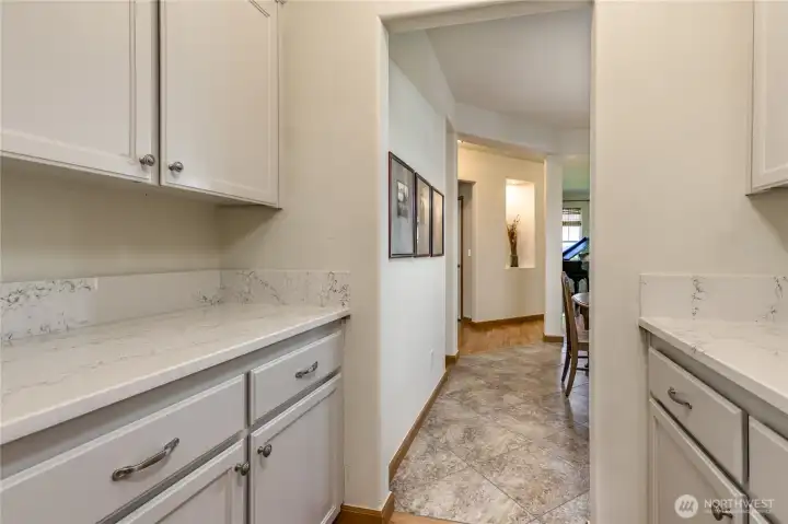 Butler's pantry provides an elegant transition from the kitchen to the formal dining room.