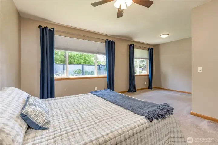 Generous primary suite offers excellent view of your beautiful back yard.