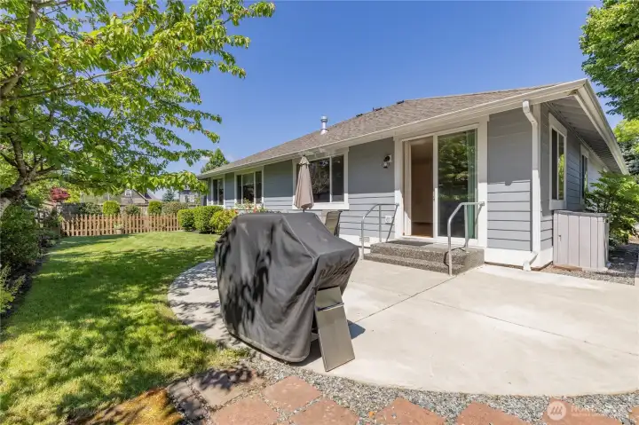 Fully-fenced backyard offers a beautiful, private lawn with a perfect mix of sun and shade.