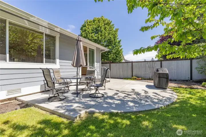 Step right outside through the slider onto this spacious patio—ideal for entertaining and enjoying the backyard.