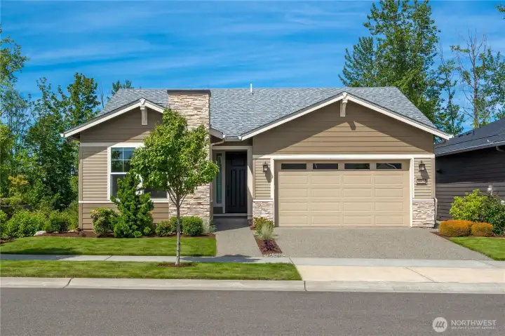 Beautiful street appeal with stone accents greets you to this stunning home with no immediate neighbor to the South allowing the home to be bathed in natural light.