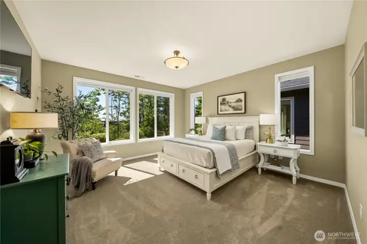 The primary suite offers premium Karastan carpet and plush pad, and overlooks the natural greenspace to the West.