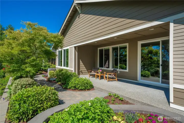 The stone raised planter, meandering pathway and thoughtful plantings make this backyard delightful yet very easy to maintain. Bathed in both Southern and Western light.