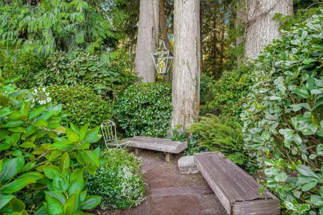 Private sitting area in the lush landscaping.