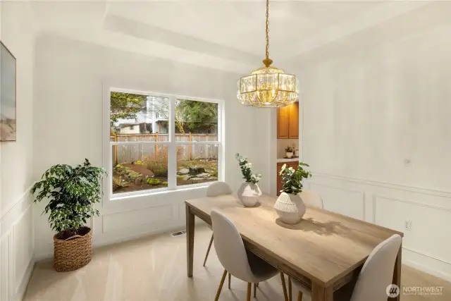 Dining room overlooks the beautifully landscaped backyard