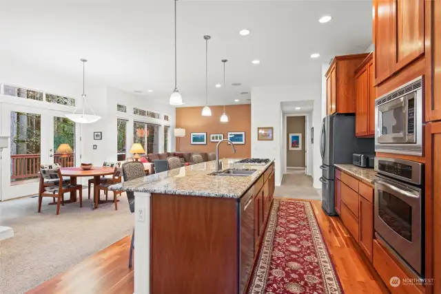 Slab granite counters, 42" upper cabinets and lower cabinets are a combination of deep drawers and cupboard with pull-out shelves.