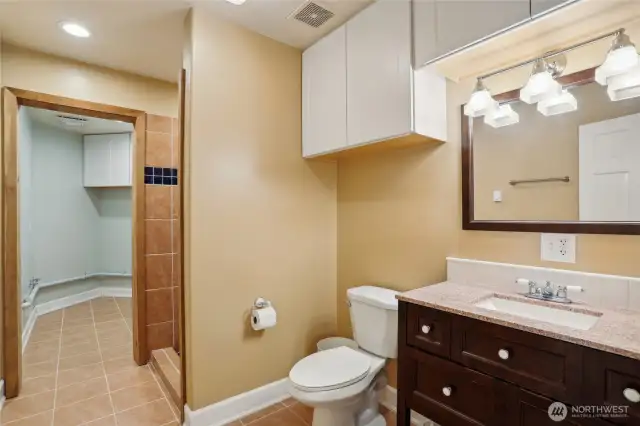 Bathroom downstairs with full laundry room