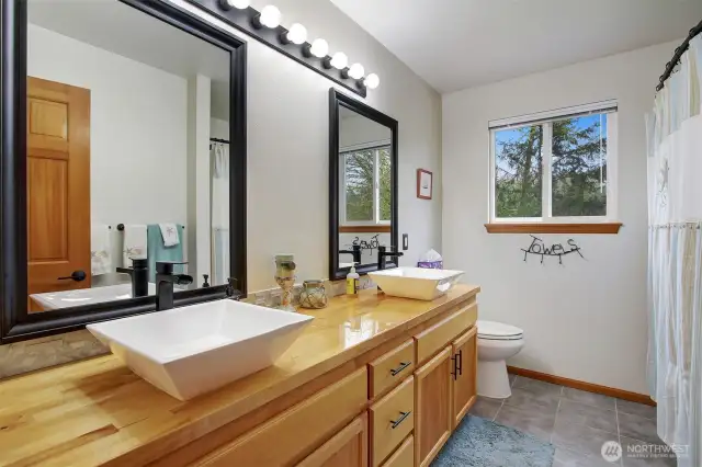 Full bathroom upstairs with double sinks.