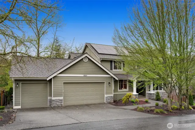 Oversized 3 car garage w/ EV charger and solar panel system.