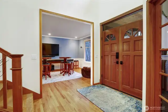 Front entry with solid wood french doors.