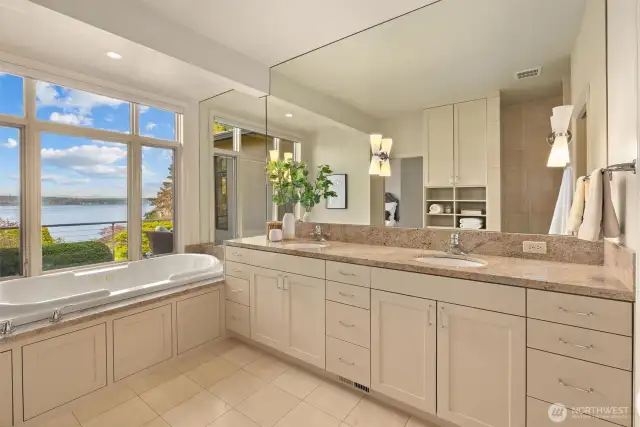 The primary five-piece bath is a true retreat, featuring a jacuzzi tub, Somfy automated shades, heated floors, a bidet, and a multi-head, spa-like shower for the ultimate in relaxation and comfort.