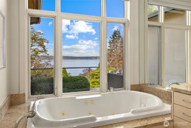 Soothe and soak in the generous, soft jacuzzi tub, where comfort meets convenience—just a push of a button and the automated shades gently lower for complete privacy.