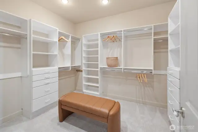 A spacious walk-in closet completes the luxurious primary retreat, offering both style and function in a beautifully designed space.