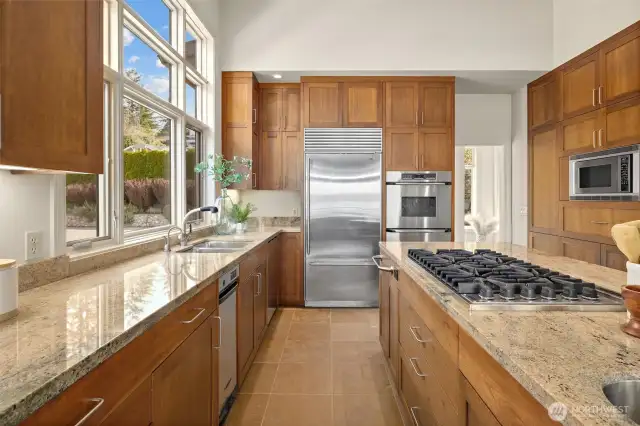 Featuring custom cabinetry, granite countertops, and top-of-the-line stainless steel appliances, this kitchen is designed for both style and functionality.