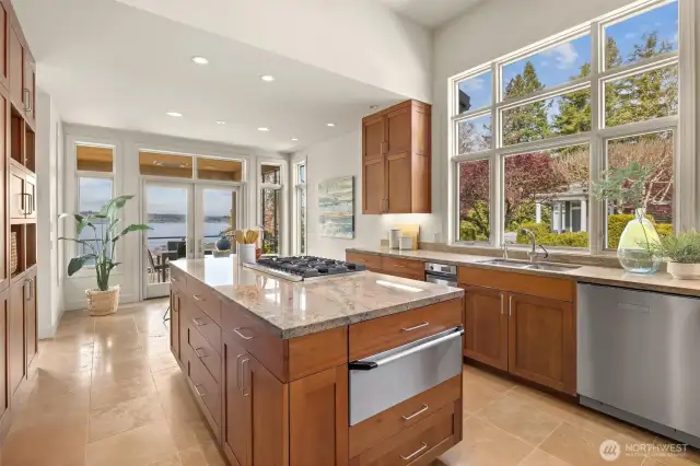 High-end stainless-steel appliances, sleek custom cabinetry, and an abundance of natural light come together in a designer kitchen layout that’s sure to inspire even the most discerning chef.