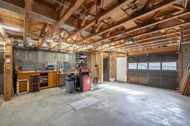 Lower level garage/shop with 1/2 bath