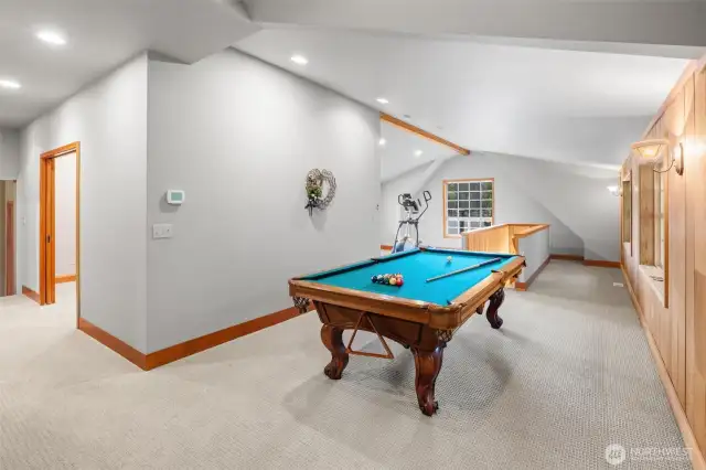 Large loft area on 2nd floor with pool table (can stay with the house) and another large space with elliptical machine (also can stay).