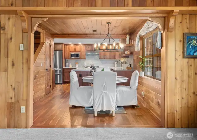 Eat in kitchen with updated light fixture and gorgeous hardwoods.