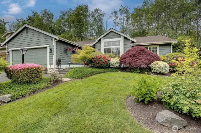 Exceptional curb appeal with manicured landscaping