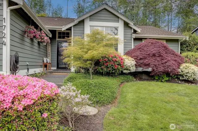 Blooming perennials line inviting entryway
