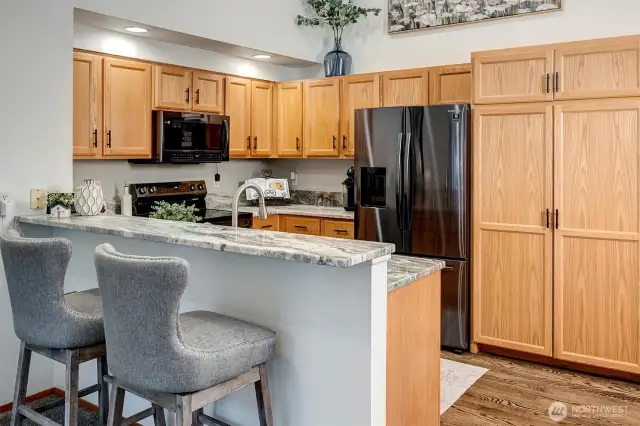 Tons of cabinet space + breakfast bar