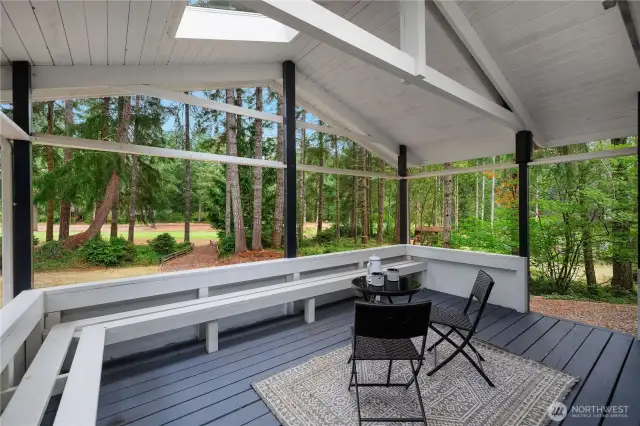 Back covered deck for year round entertaining and lots of built in seating.